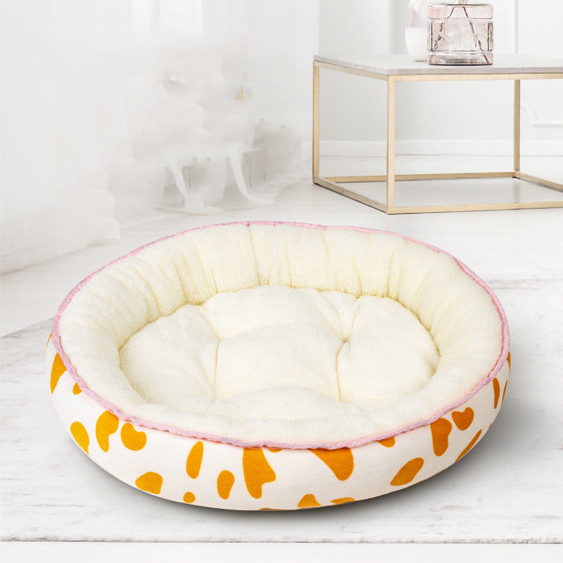 Oval Dog Bed with Bolster Rim in Amber spots